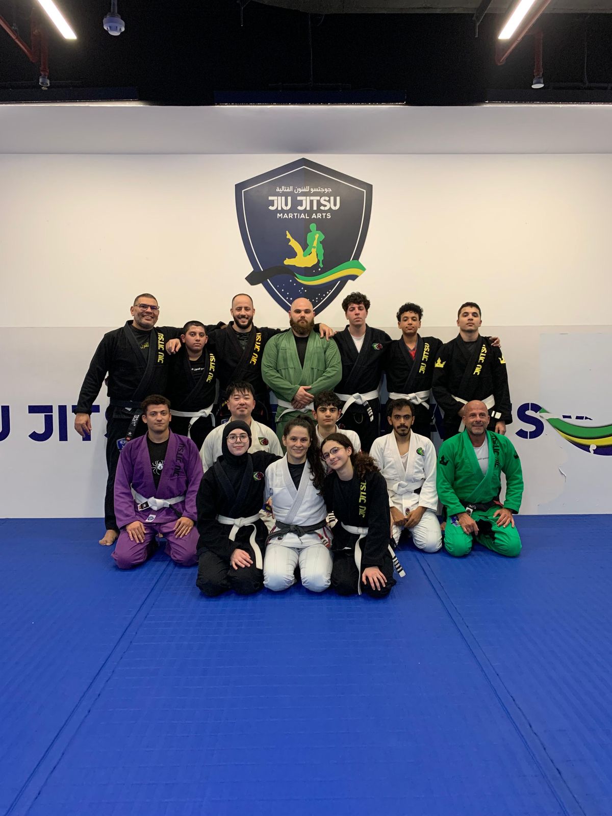 Brazilian Jiu Jitsu Qatar adult students at JJMA Doha with their instructors