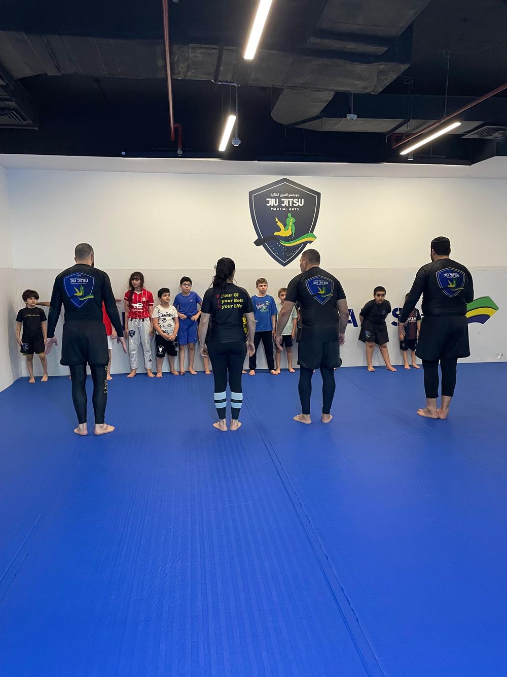 Children learning discipline through jiu jitsu in Qatar